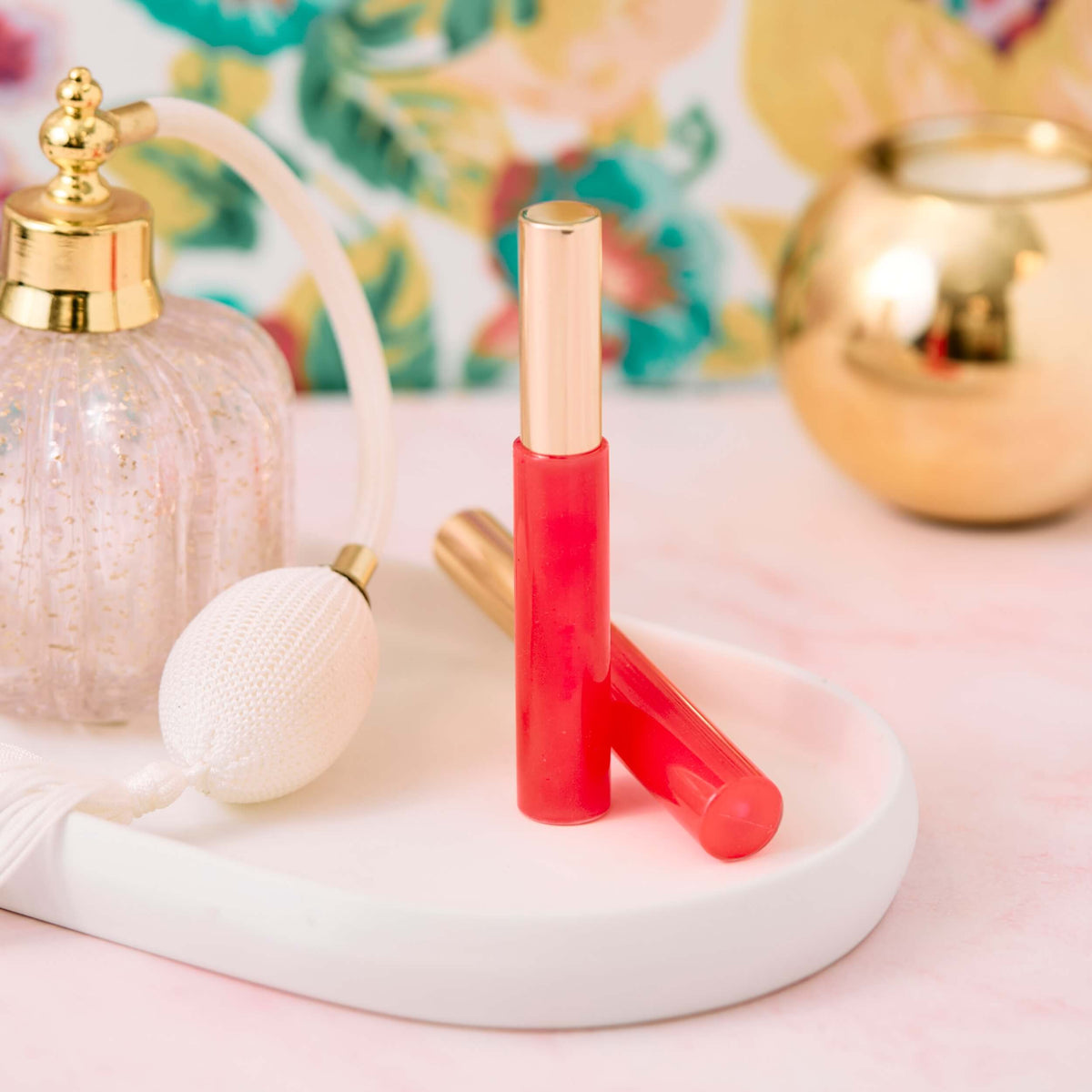pink lip gloss on a tray