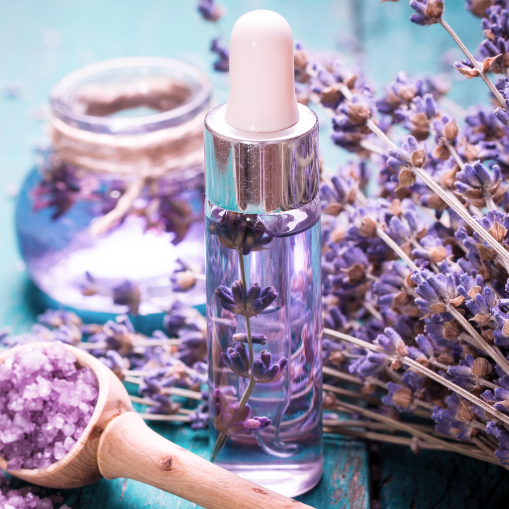 Premium Photo  Lilac essential oil in small bottles