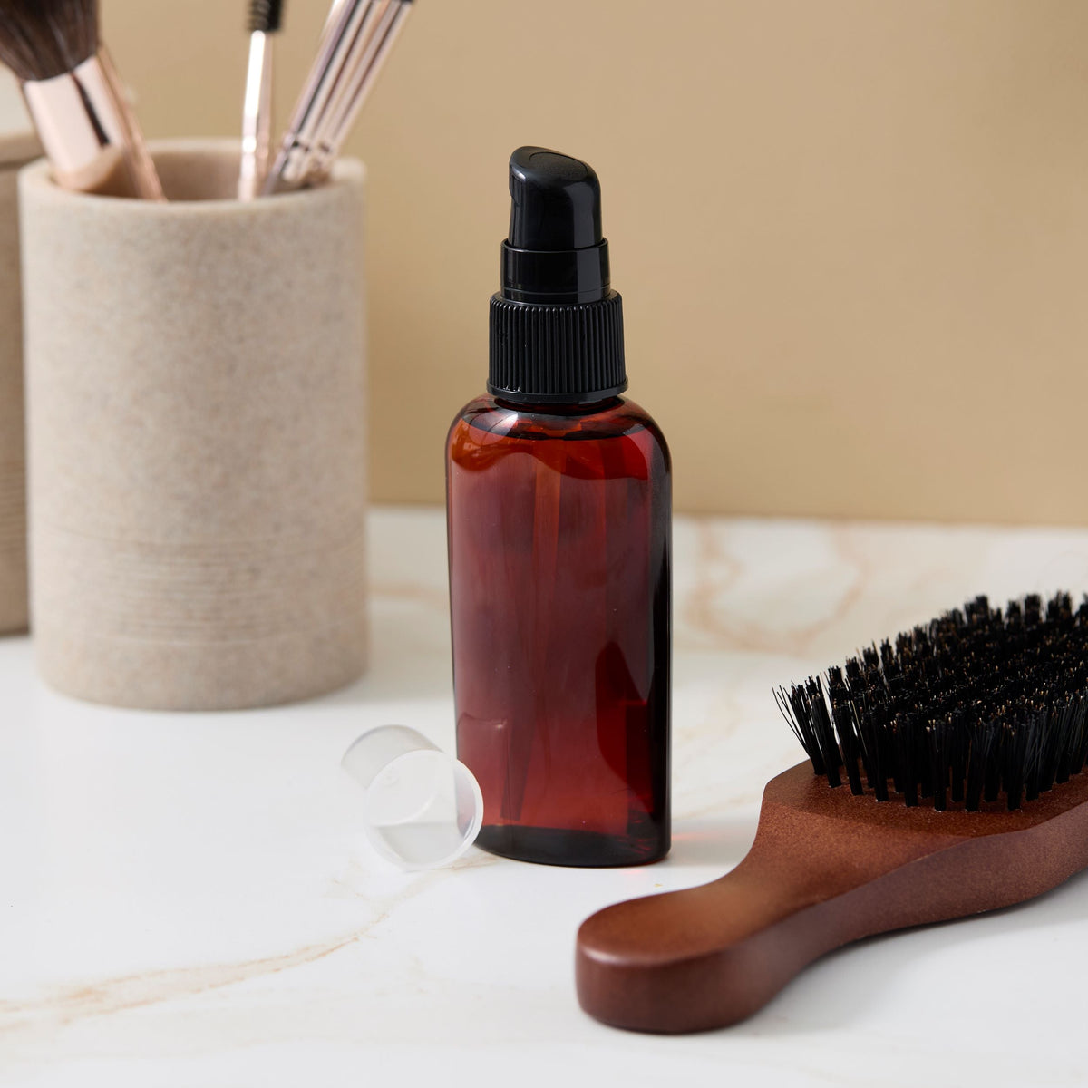 hair serum in an amber bottle