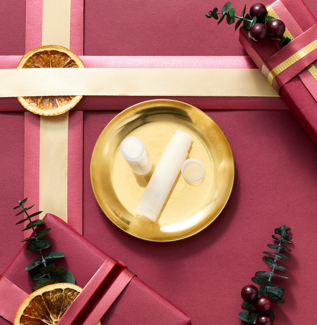 Honey tea lip balm on holiday background