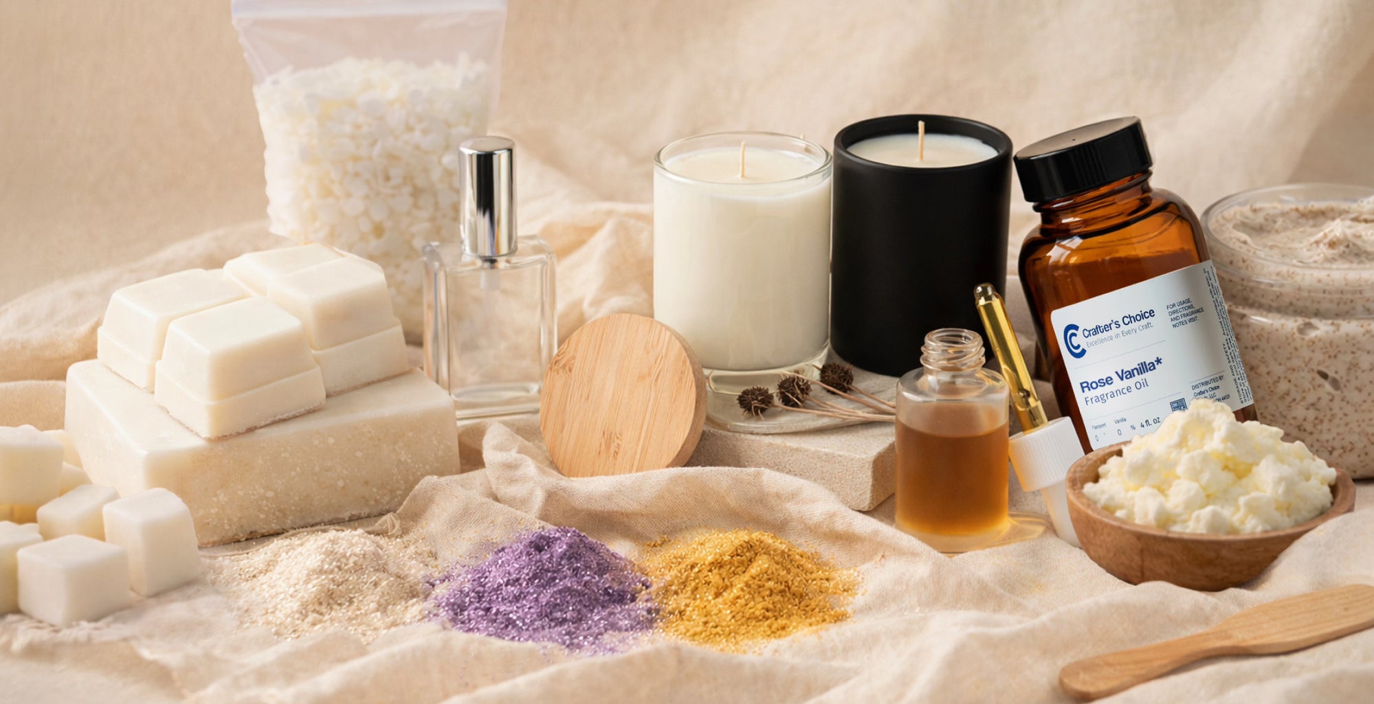 Neutral-toned display of soap making supplies including melt-and-pour soap cubes, fragrance oils, candles, shea butter, botanical powders, and a jar of scrub arranged on soft fabric for a clean, natural aesthetic.